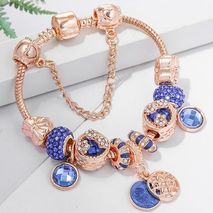 Rosésilbernes Armband mit blauem Kristall